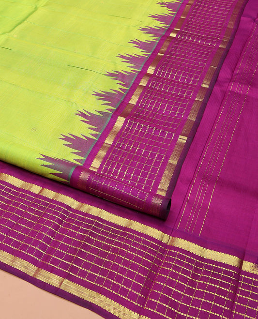Green Kanchipuram Silk Saree, Finely Crafted with Zari Buttas on Its Body, Complemented by a Contrast One-Sided Thazampoo Rekku Border of Muthu Checked Designs, Pallu of Thazampoo Designs, and Comes Without a Blouse