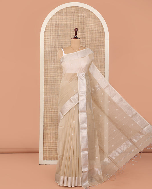 Beige Maheshwari Cotton Saree, Detailed with Flower Buttas All Over Its Body, Highlighted by Traditional Zari Design Border, Pallu Steeped with Flower Buttas, and Paired with a Matching Blouse