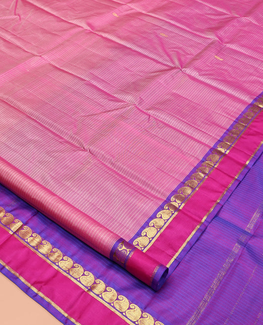 Pink Kanchipuram Silk Saree, Sparsely Woven with Vazhaipoo Stripes and Zari Buttas on Its Body, Complemented by Contrast Rettai Pettu Border of Kathir, and Vanki Manga Designs, Zari-Striped Pallu, and Paired with a Contrast Blouse