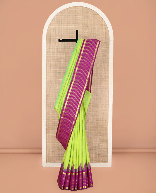 Green Kanchipuram Silk Saree, Finely Crafted with Zari Buttas on Its Body, Complemented by a Contrast One-Sided Thazampoo Rekku Border of Muthu Checked Designs, Pallu of Thazampoo Designs, and Comes Without a Blouse