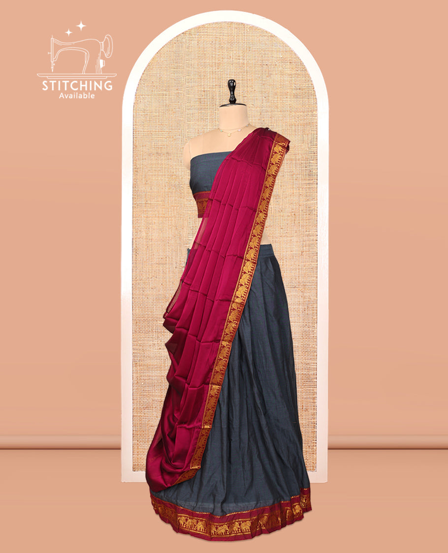Grey Cotton Half-Saree Features Plain Skirt, a Contrast Elephant Border, a Matching Blouse, and a Contrast Dhavani