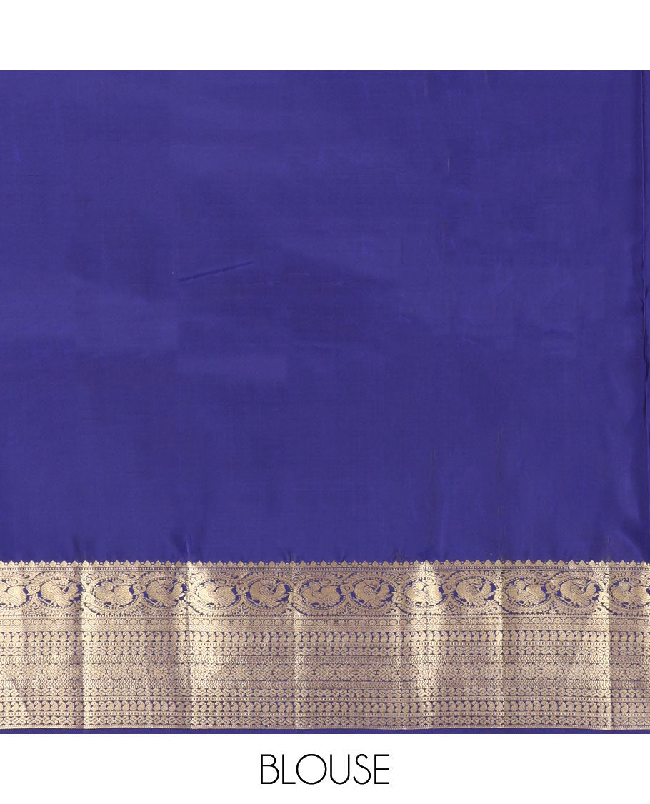 Blue Vasundhara Silk Saree, Decorated with Zari Buttas All Over Its Body, Highlighted by Zari Border of Rekku, Muthu, Mayil, Manga, Muthu, Kathir, Laddu Kamalam, and Cross Neli Designs, Pallu Mirrors the Same Designs, and Paired with a Matching Blouse