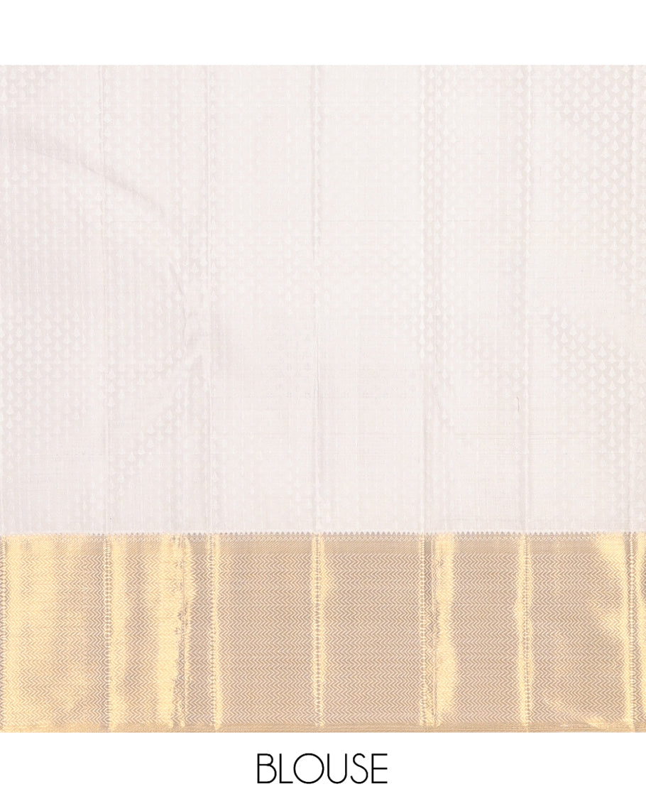 Cream Embossed Parambara Silk Saree, Enthralled with Zari Buttas, a Zari Border of Thilakam Mokku, and Vanki Designs, Grand Pallu, and Matching Blouse