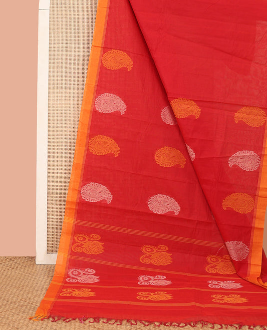 Red Kanchi Cotton Saree, Accentuated with Paisley Buttas All Over Its Body, Complemented by Contrast Border, Pallu Steeped with Floral Design, and Paired with a Matching Blouse