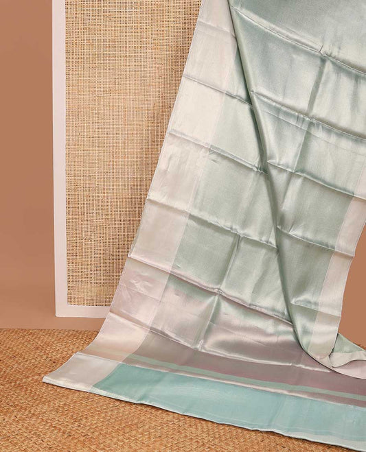 light blue chevron design tissue saree with contrast striped border & zari design pallu