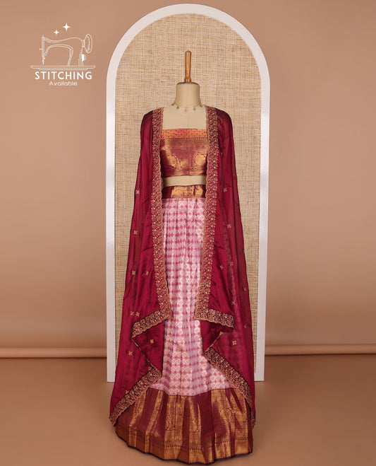 Light pink geometric design banaras half saree with contrast zari design border, floral design blouse & floral embroidery, scallop border dhavani