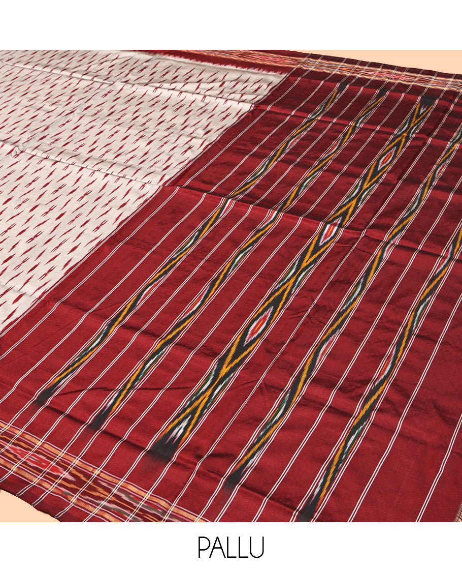Grey-Red Pochampally Ikat Silk Saree, Adorned with Ikat Buttas, Complemented by a Contrast Ikat Border, Ikat-Style Pallu, and No Blouse