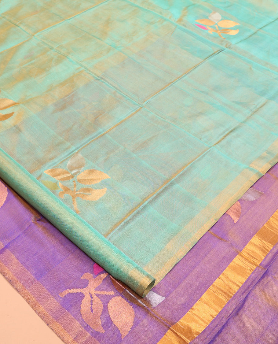 Green Uppada Silk Saree, Accentuated with Floral Vine Zari Buttas, a Zari Border, Complemented by Contrast Grand Pallu of Floral Buttas and a Contrast Blouse