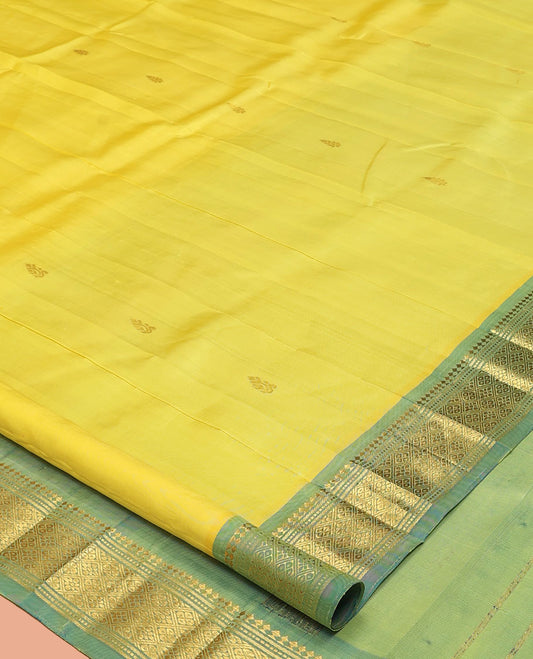 Yellow Kanchipuram Silk Saree, Sparsely Sparkled with Zari Buttas, a Contrast One-Sided Border of Panner Sombu, Banaras, Muthu, and Jaal Designs, a Zari Design Pallu, and No Blouse