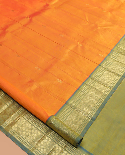 Orange Kanchipuram Silk Saree, Ornamented with Zari Buttas, a Contrast One-Sided Border of Paneer Sombu, Banaras, Muthu, and Jaal Design, Zari Design Pallu, and No Blouse
