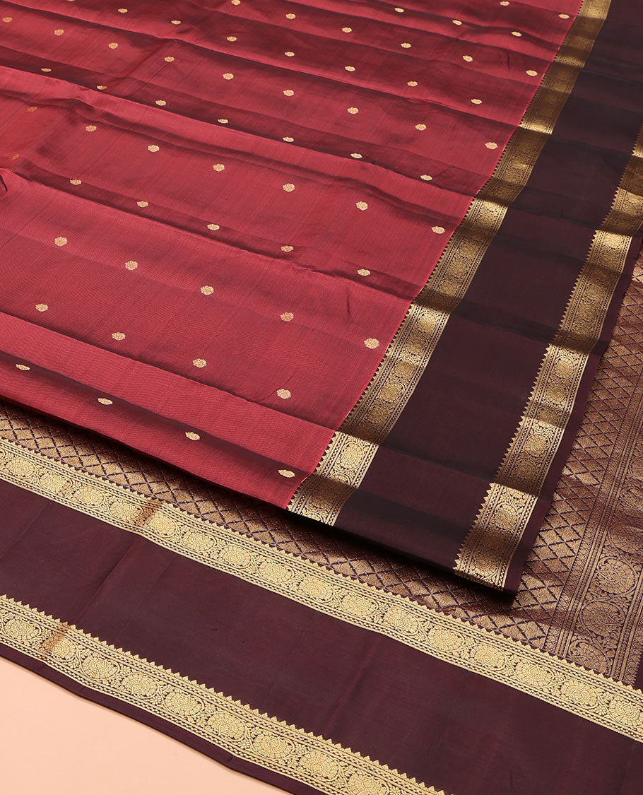 Red Vasundhara Lite Silk Mix Saree, Embellished with Zari Buttas on Its Body, Complemented by a Contrast Rettai Pettu Border of Kodi Visiry Designs, Boldly Accentuated Pallu of Jaal Designs, and Paired with a Contrast Blouse