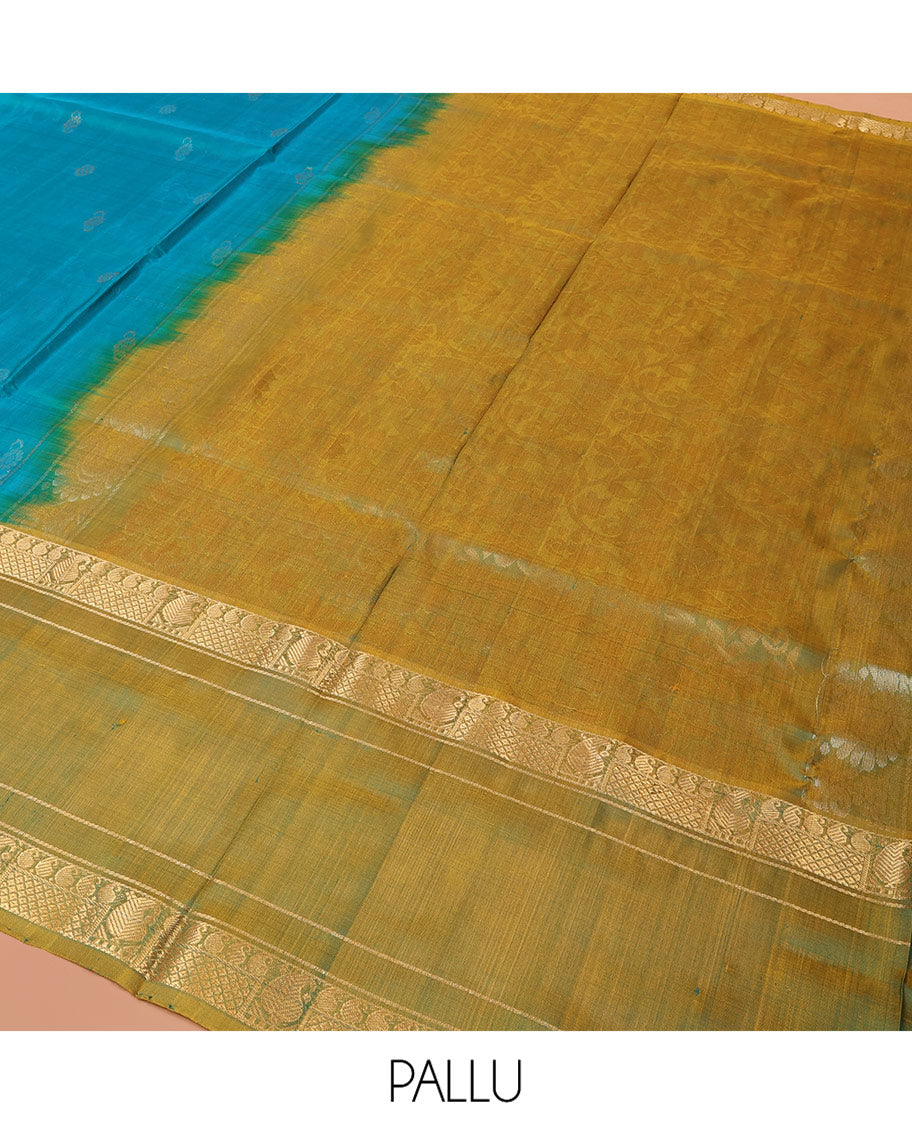 Blue Uppada Silk Saree Graced with Zari Buttas, Complemented by a Contrast Traditional Zari Border of Peacock Veena Designs, Contrast Pallu of Floral Jaal Designs, and Paired with a Contrast Blouse