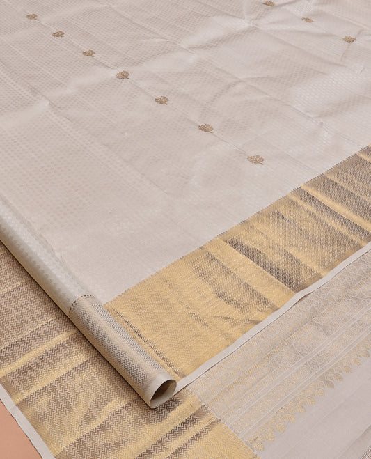 Cream Embossed Parambara Silk Saree, Enthralled with Zari Buttas, a Zari Border of Thilakam Mokku, and Vanki Designs, Grand Pallu, and Matching Blouse