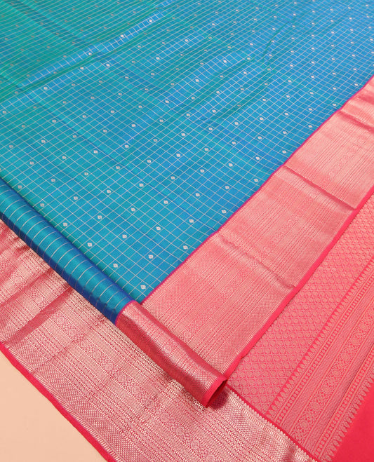 Blue Vasundhara Silk Saree, Featuring Zari Butta Enclosed Checks, a Contrast Border of Thilakam Mokku, Muthu, Mayil Kann, Rettai Neli, and Vanki Designs, Jaal Pallu, and Contrast Blouse