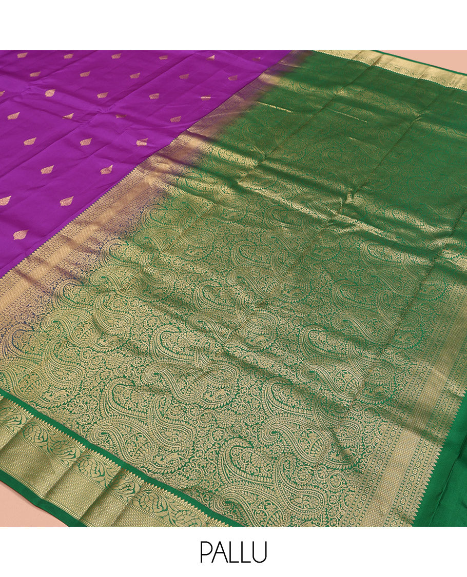 Purple Vasundhara Silk Saree, Ornamented with Zari Buttas All Over Its Body, Complemented by a Contrast Border of Rekku, Muthu, and Kodi Visiry Designs, Grand Pallu Steeped with Manga Designs, and Paired with a Contrast Blouse