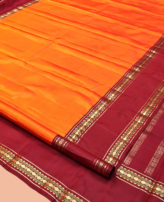 Orange Plain Kanchipuram Silk Saree, Complemented by a Contrast Rettai Pettu Border of Rekku, Muthu, and Poun Designs, Seppu Rekku Pallu, and a Contrast Blouse