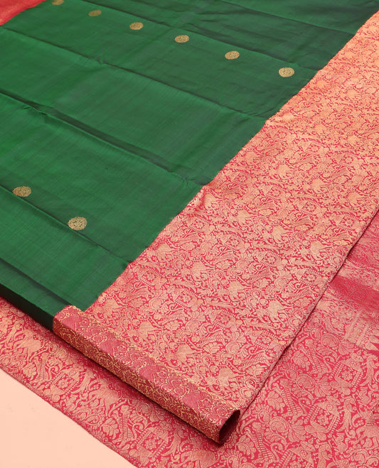 Green Kanchipuram Designer Silk Saree, Entralled with Chakram Buttas All Over Its Body, Complemented by Contrast Historically Woven Border of Yaali and Yaanai Designs, Grand Jaal Pallu and Paired with a Contrast Blouse