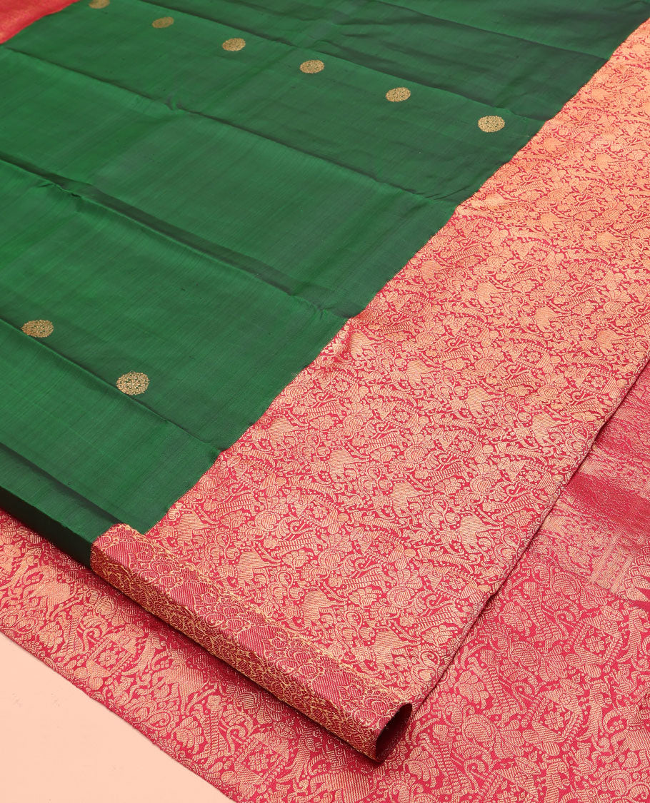 Green Kanchipuram Designer Silk Saree, Entralled with Chakram Buttas All Over Its Body, Complemented by Contrast Historically Woven Border of Yaali and Yaanai Designs, Grand Jaal Pallu and Paired with a Contrast Blouse