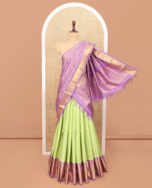 Green Pure Silk Half-Saree, Artfully Detailed with Mayil-Chakram Buttas on Its Skirt, Complemented by a Contrast Border of Rekku, Muthu, Diamond, Chakram, and Jaal Designs, Comes with a Contrast Blouse and a Dhavani of Jacquard Design