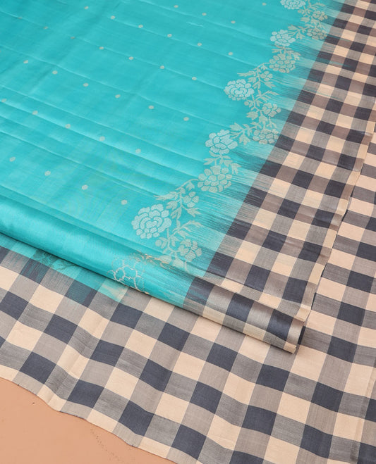 Blue Mayuri Soft Silk Saree, Steeped in Richness with Buttas and Floral Designs on Its Body, Complemented by Contrast Checked Border, Checked Pallu, and Paired with a Contrast Checked Blouse