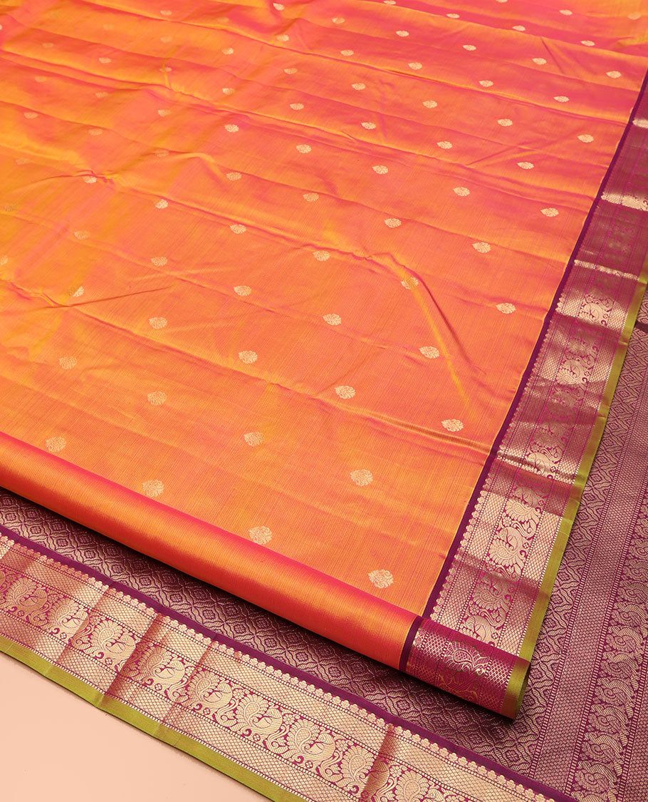 Orange Kanchipuram Silk Saree, Mesmerized with Zari Buttas on Its Body, Complemented by a Contrast Border of Muthu, Mayil Kann, and Mayil Designs, Grand Jaal Pallu, and Paired with a Contrast Blouse