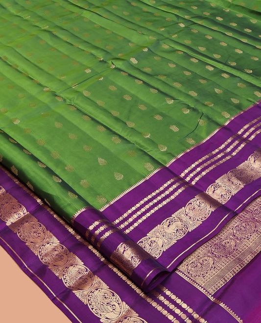Green Vasundhara Lite-Silk Mix Saree Featuring Zari Buttas, a Contrast Rekku Border of Rudraksham, Round Mayil, and Round Yaali Designs, Grand Pallu, and a Contrast Blouse