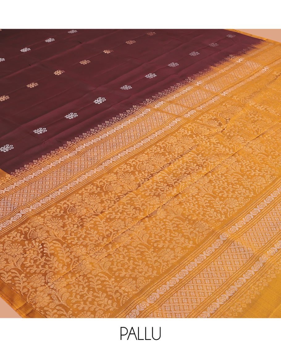 Maroon Mayuri Lite Silk Mix Saree, Bedecked with Zari Buttas, Complemented By Contrast Peacock Buttas Border, a Floral Vine Pallu, and a Contrast Blouse