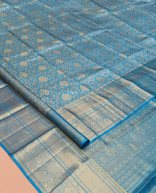 Blue Kanchipuram Tissue Silk Saree, Elegantly Framed with Jacquard Designs on Its Body, Highlighted by a Zari Border of Traditional Designs, Intricately Designed Pallu, and Paired with a Matching Blouse