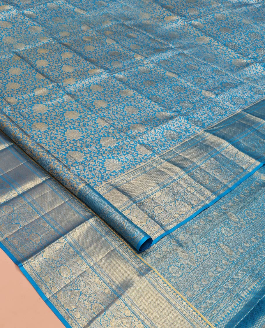 Blue Kanchipuram Tissue Silk Saree, Elegantly Framed with Jacquard Designs on Its Body, Highlighted by a Zari Border of Traditional Designs, Intricately Designed Pallu, and Paired with a Matching Blouse