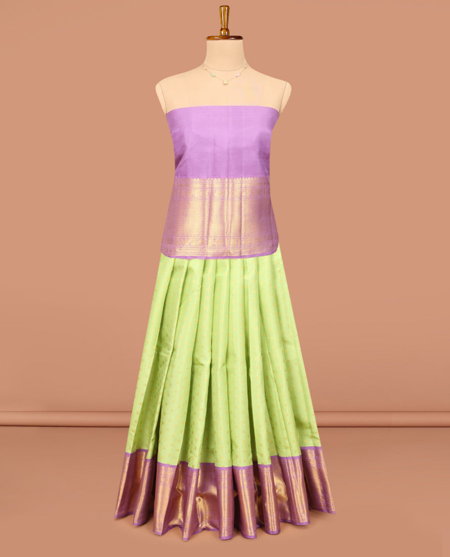 Green Pure Silk Half-Saree, Artfully Detailed with Mayil-Chakram Buttas on Its Skirt, Complemented by a Contrast Border of Rekku, Muthu, Diamond, Chakram, and Jaal Designs, Comes with a Contrast Blouse and a Dhavani of Jacquard Design