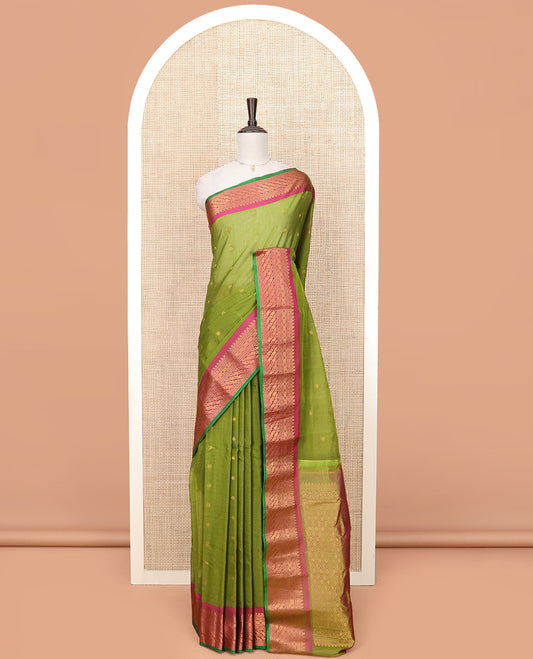 Green Gadwal Saree Decorated with Zari Buttas, Contrast Border Steeped with Traditional Zari Designs, Pallu of Jaal Design, and a Contrast Blouse Highlighted with Zari Border