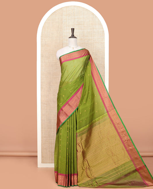 Green Gadwal Saree Decorated with Zari Buttas, Contrast Border Steeped with Traditional Zari Designs, Pallu of Jaal Design, and a Contrast Blouse Highlighted with Zari Border