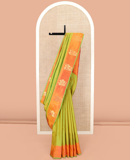 Parrot Green Kanchipuram Silk Saree, Beautifully Designed with Zari Buttas, Complemented by a Contrast Border of Floral Zari Designs, Pallu Adorned with Manga Designs, and Paired with a Contrast Blouse