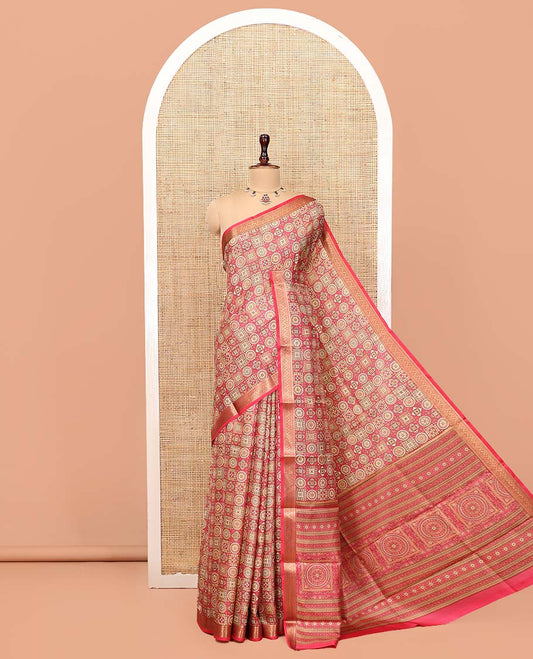 Pink Printed Silk Saree, Gracefully Embellished with Geometric Prints, Highlighted by a Traditional Zari Border, Printed Pallu, and a Matching Blouse