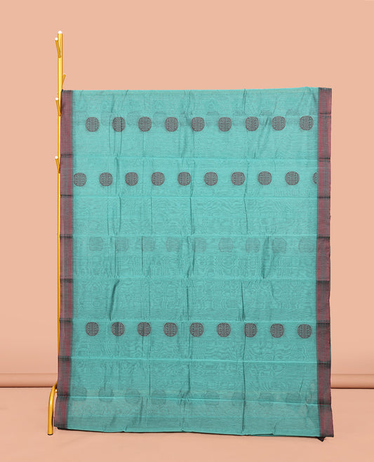 Blue Semi-Silk Cotton Saree, Finely Crafted with Round Buttas on Its Body, Complemented by a Contrast Thread Traditional Motifs Woven Border, Jaal Design Pallu, and Paired with a Contrast Blouse