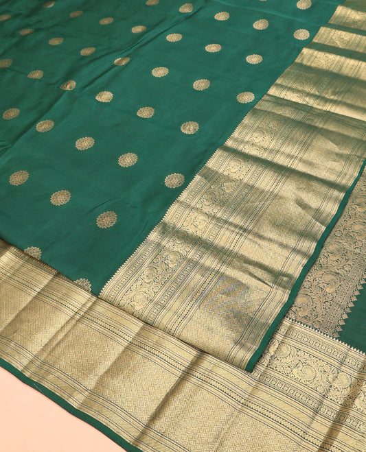 Green Vasundhara Lite Silk Mix Saree, Spotlighted with Zari Buttas On Its Body, Highlighted by Zari Border of Rekku, Kamalam, Mayil, and Jaal Designs, Intricate Pallu and Paired with a Matching Blouse