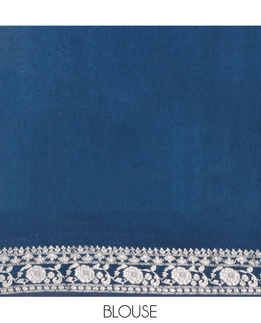 Blue Fancy Crepe Saree, Gleamed Up with Thilakam Buttas, Highlighted by a Traditional Border, Intricately Designed Pallu, and a Matching Blouse