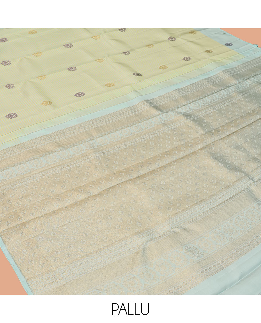 Green Kanchipuram Silk Saree, Subtly Sparkled with Stripes and Thread Buttas, Complemented by a Contrast Border, Jaal Pallu, and Contrast Blouse
