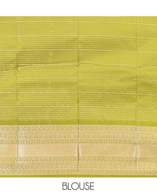 Green Art Silk Half-Saree Pavadai Material Gleamed Up with Zari-Buttas Skirt, a Contrast Traditional Border, Contrast Blouse, and Intricate Dhavani