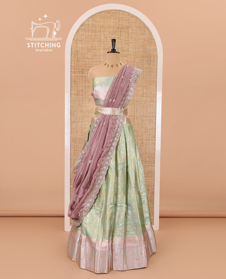 Pale green banarasi half-saree, floral jaal thread weave with contrast floral thread bordered skirt, a matching blouse, and scallop embroidered dhavani with belt