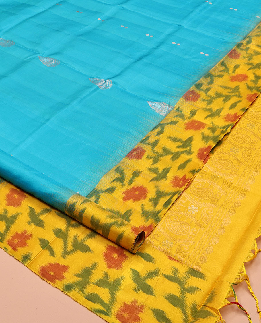 Blue Mayuri Soft Silk Saree, Elevated with Zari Buttas, Contrast Ikat Floral Border, and a Pallu Features Paisleys and a Contrast Blouse