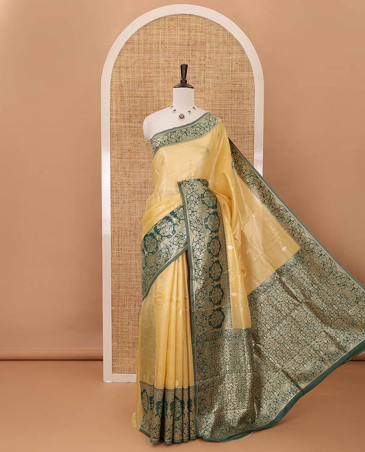 Yellow Antique buttas twill tissue saree, contrast satin thread woven border & pallu of mughal-style motifs & buttas dark green blouse