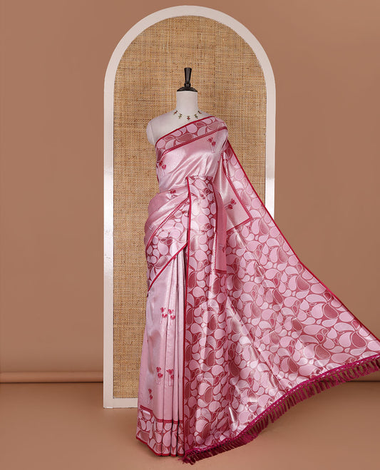 Pink jacquard kanchi silk saree, contrast border, and pallu steeped with paisley motifs with contrast zari design blouse