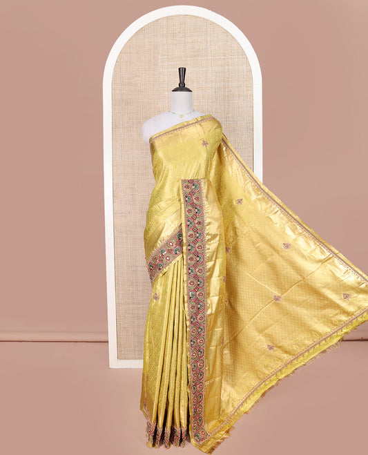 Yellow Vastrakala Silk Saree, Artfully Detailed with Floral Jacquard and Patch Work, Complemented by Mixed Intricately Embroidered Border, Grand Jaal Design Stone Work Pallu, and Paired with Heavy Embroidered Blouse