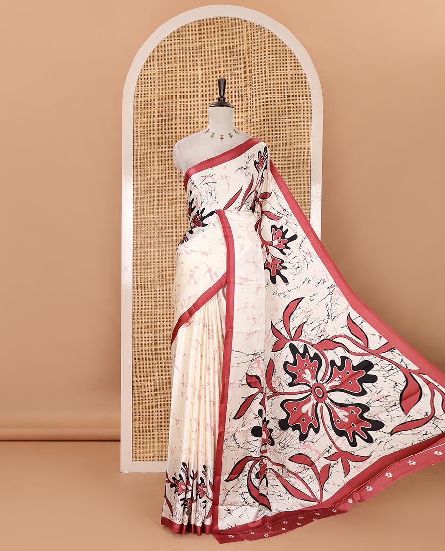 Cream-base batik-style floral printed satin crepe saree, contrast onion pink border, printed pallu & contrast floral printed blouse