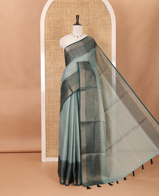 Green plain tissue saree, contrast gold zari piping border & self pallu with tussels