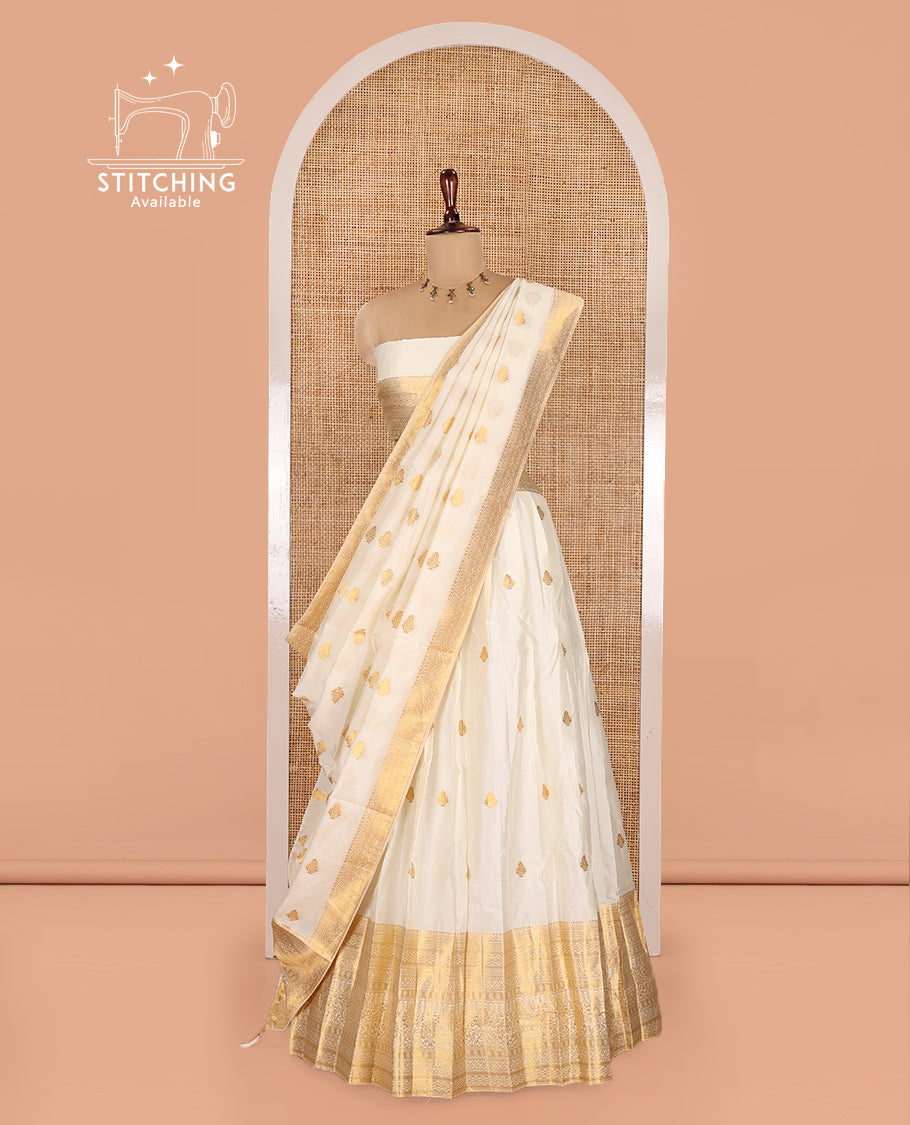Cream Banarasi Silk Half-Saree Features Zari Buttas Skirt, a Traditional Border, Matching Blouse, and Zari-Woven Dhavani