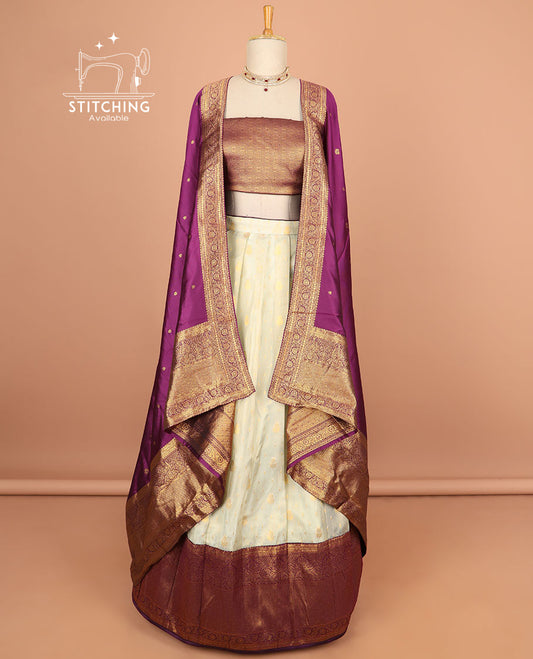 Cream buttas half saree with contrast zari design border, zari design blouse & purple floral vine zari design dhavani