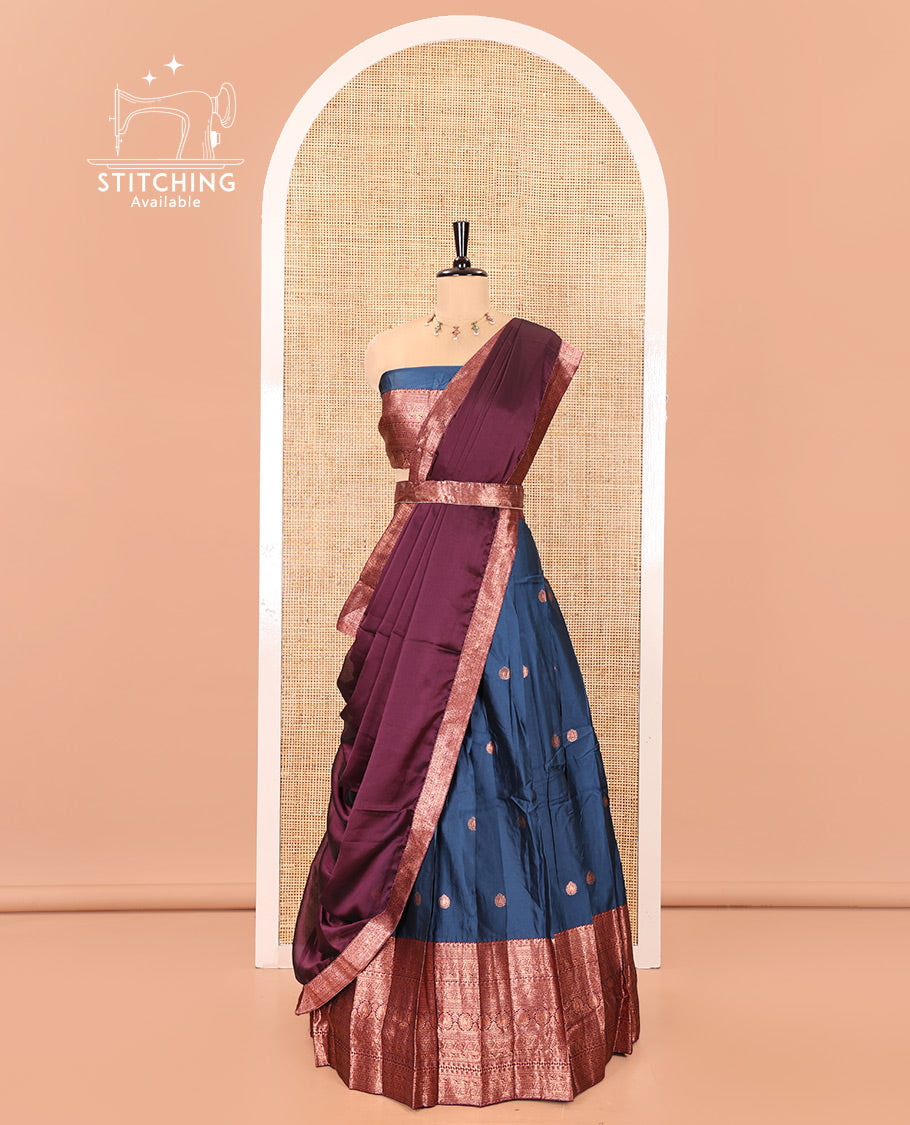 Blue and Purple Semi-Banarasi Half-Saree, Accentuated with Zari Buttas on Its Skirt, Complemented by a Contrast Traditional Zari-Design Border, Paired with a Matching Blouse, and a Contrast Satin Georgette Zari-Bordered Dhavani