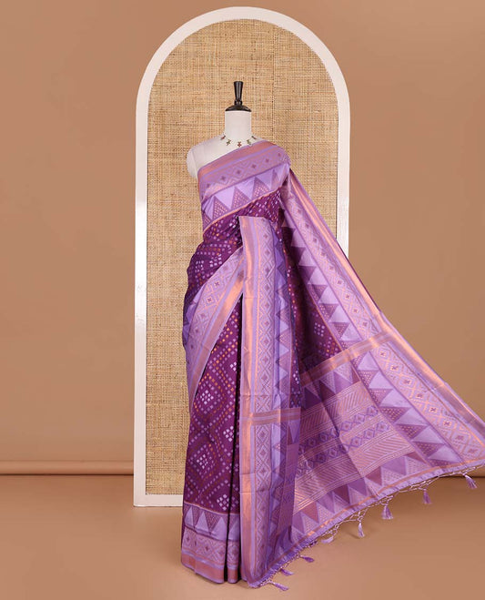 Dark violet ikkat style zari and thread buttas semi-tussar saree, contrast ikkat design border, geometric patterned pallu, and a contrast blouse